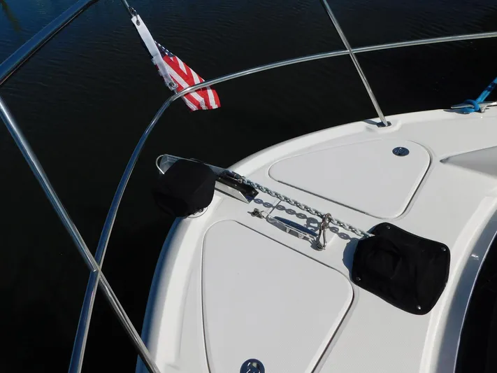 Just Rite Yacht Photos Pics Bow of 2004 Sea Ray 390 Motor Yacht with anchor chain and American flag.