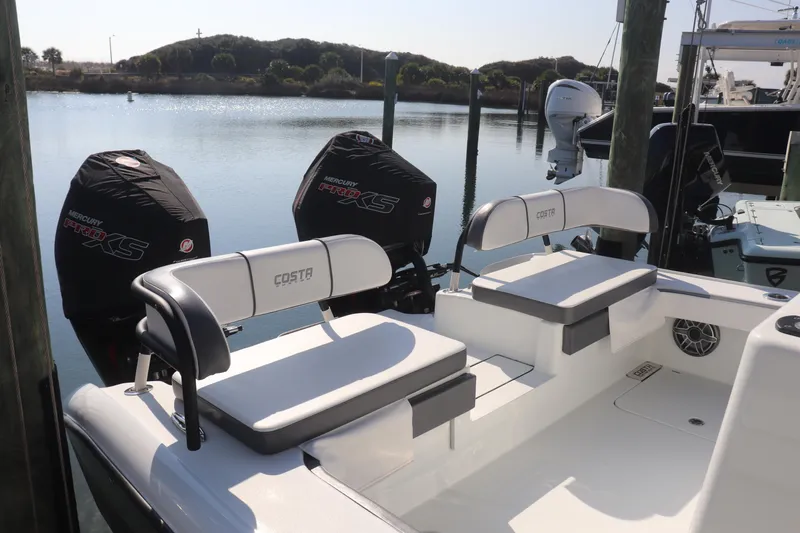  Yacht Photos Pics 2021 Costa Custom Boats 26 with dual Mercury Pro XS engines docked by the water.