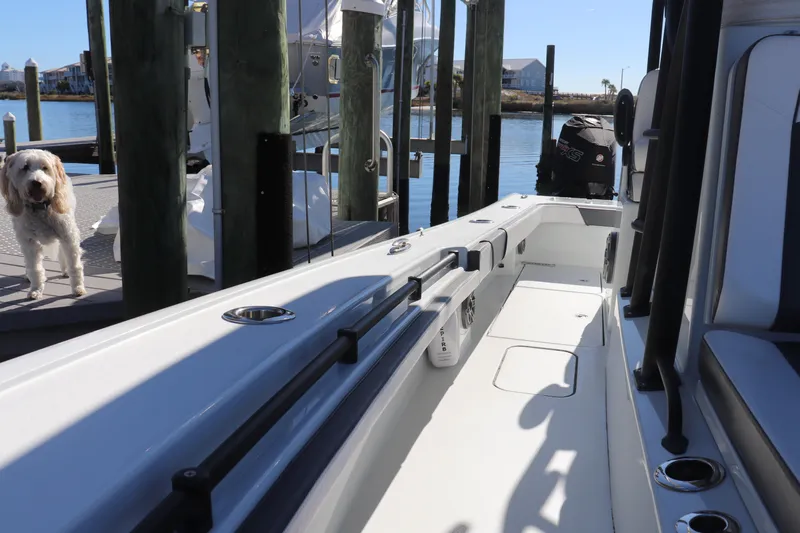  Yacht Photos Pics 2021 Costa Custom Boats 26 docked, featuring spacious deck and outboard motor.