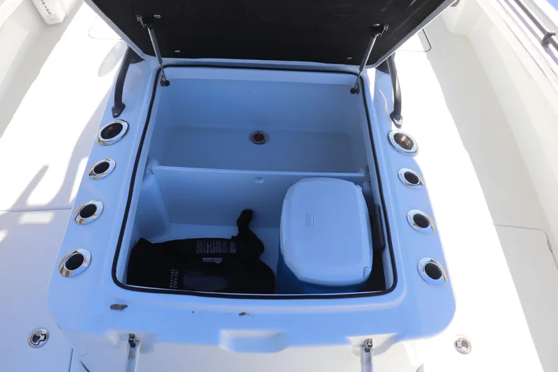  Yacht Photos Pics Open storage compartment on 2021 Costa Custom Boats 26, featuring multiple rod holders.