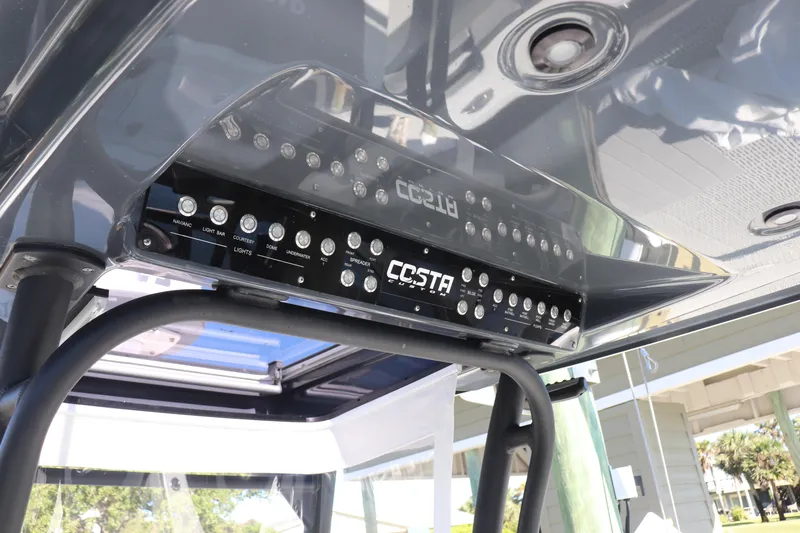  Yacht Photos Pics Control panel of a 2021 Costa Custom Boats 26, featuring various light switches.