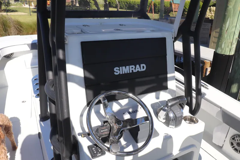  Yacht Photos Pics 2021 Costa Custom Boats 26 dashboard with Simrad navigation system and steering wheel.