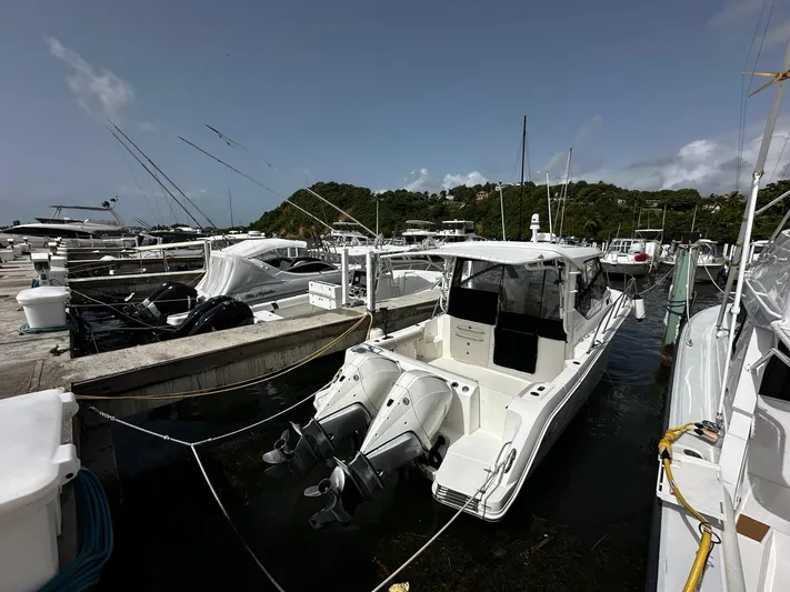  Yacht Photos Pics 2020 Boston Whaler 325 Conquest docked at marina with twin engines.