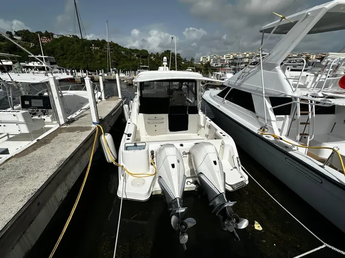  Yacht Photos Pics 2020 Boston Whaler 325 Conquest docked at marina with twin outboard engines.