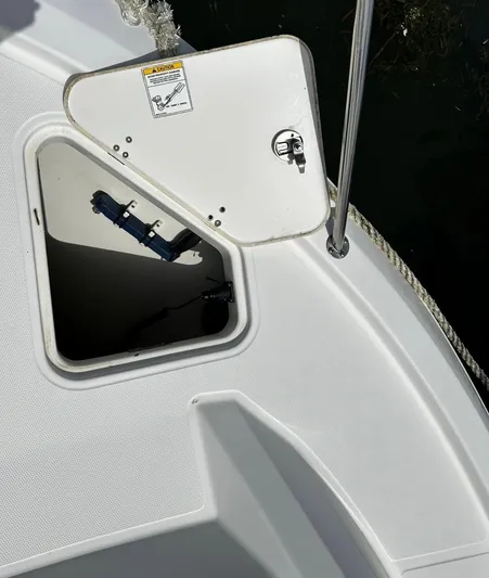  Yacht Photos Pics Open hatch on 2020 Boston Whaler 325 Conquest boat deck, showing interior compartment.