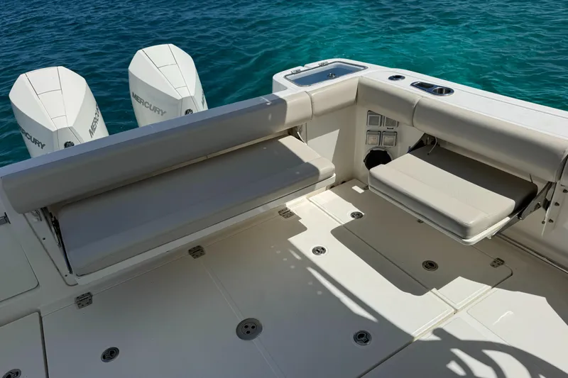  Yacht Photos Pics 2020 Boston Whaler 325 Conquest boat interior with seating and Mercury engines.