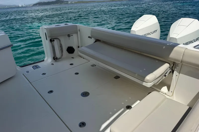 Yacht Photos Pics 2020 Boston Whaler 325 Conquest boat deck with seating and Mercury engines.