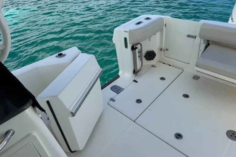  Yacht Photos Pics 2020 Boston Whaler 325 Conquest boat deck with seating, near turquoise water.