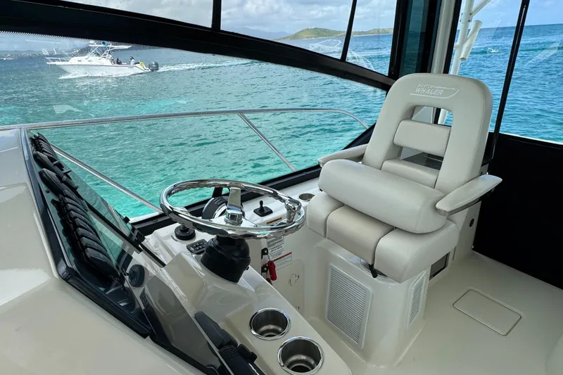  Yacht Photos Pics Helm of 2020 Boston Whaler 325 Conquest with luxurious seating and ocean view.