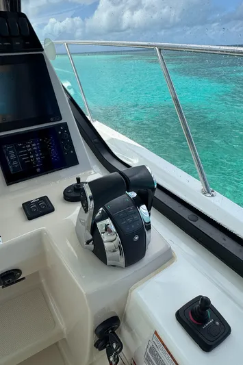  Yacht Photos Pics Cockpit view of 2020 Boston Whaler 325 Conquest with turquoise ocean backdrop.