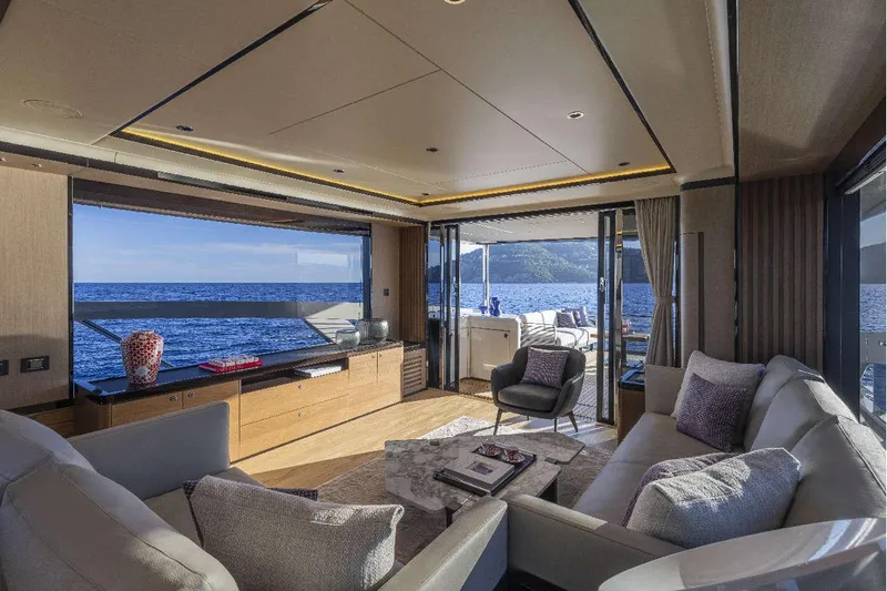  Yacht Photos Pics Luxurious interior of 2026 Absolute NAVETTA 75 yacht with ocean view and modern furnishings.