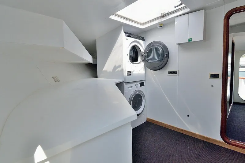 Madame Thelma Yacht Photos Pics Laundry room inside 1975 CRN Ancona Navetta 40 yacht, featuring washer and dryer.