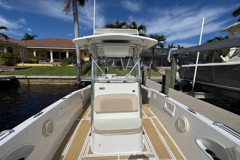  Yacht Photos Pics 2014 Stamas 317 Tarpon boat docked, featuring spacious deck and modern design.