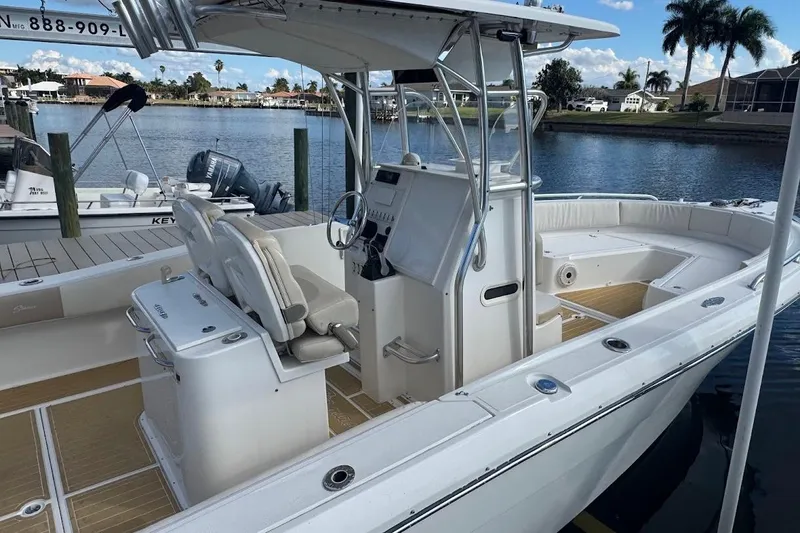  Yacht Photos Pics 2014 Stamas 317 Tarpon boat docked, featuring spacious seating and modern controls.