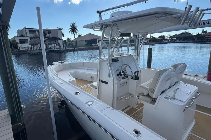  Yacht Photos Pics 2014 Stamas 317 Tarpon boat docked by waterfront homes.