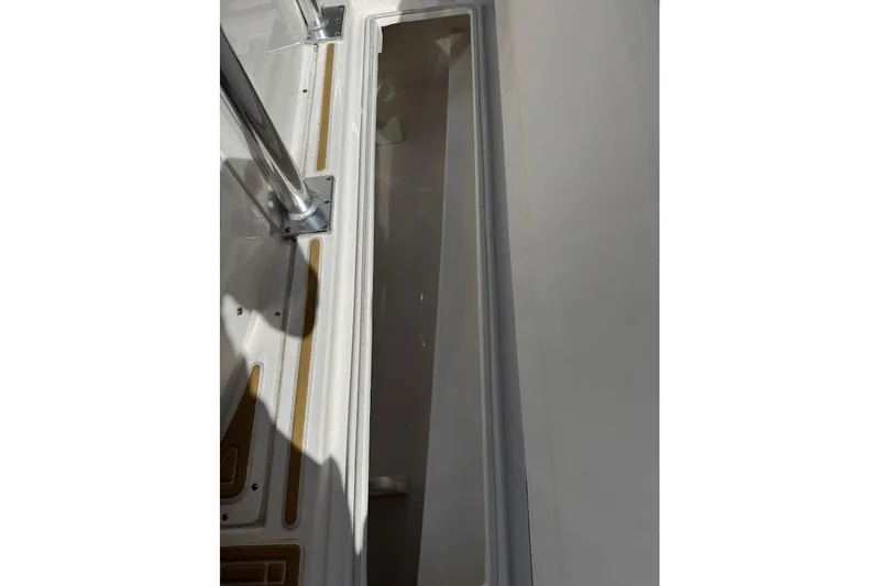  Yacht Photos Pics 2014 Stamas 317 Tarpon boat interior detail with storage compartment and metal fixtures.