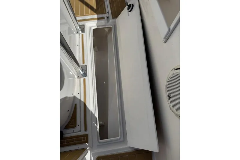  Yacht Photos Pics Open storage compartment on 2014 Stamas 317 Tarpon boat deck.