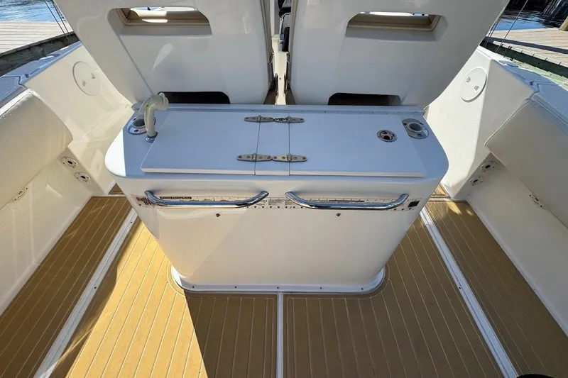  Yacht Photos Pics 2014 Stamas 317 Tarpon boat interior with white console and teak flooring.