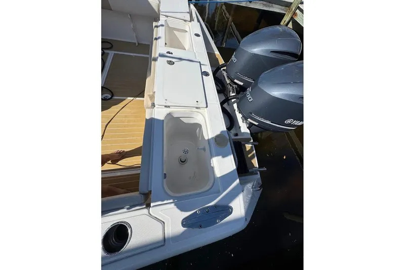  Yacht Photos Pics 2014 Stamas 317 Tarpon boat with dual Yamaha outboard engines, docked.
