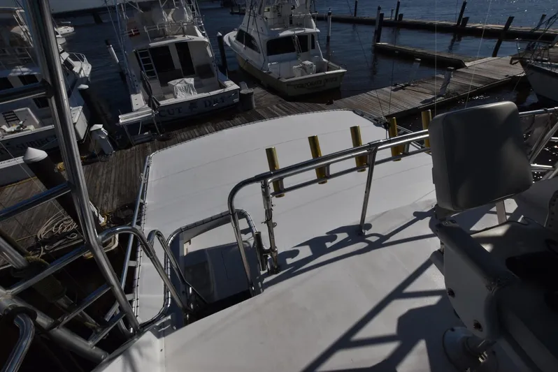 The Office Yacht Photos Pics View from the deck of a 1987 Hatteras SportFish yacht docked at a marina.