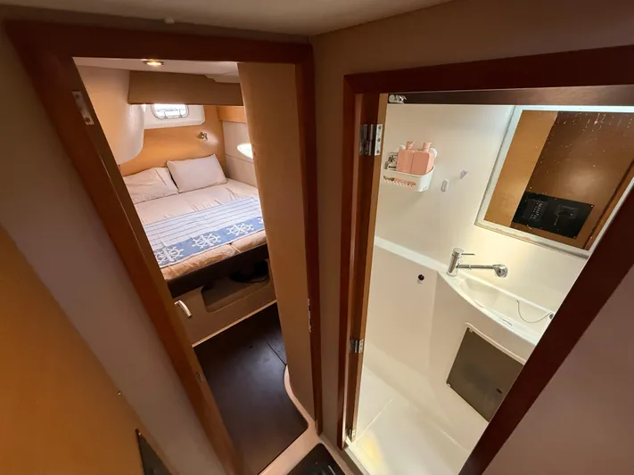 Benevah Yacht Photos Pics Interior of 2013 Fountaine Pajot Lipari 41, featuring a cozy bedroom and compact bathroom.