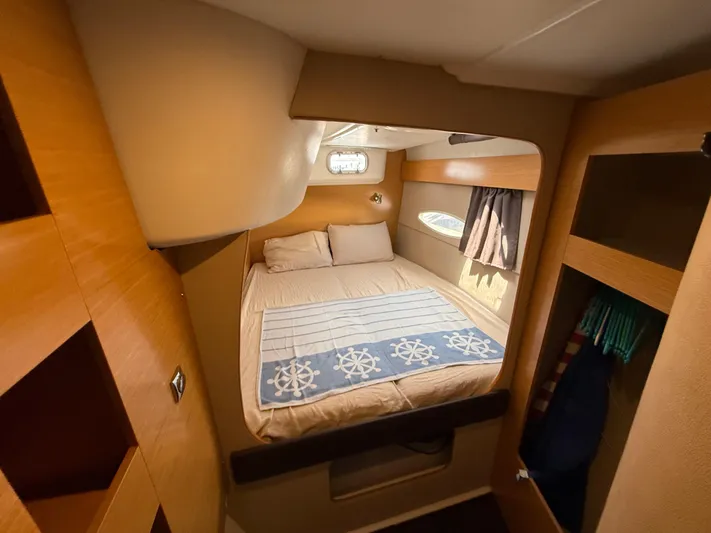 Benevah Yacht Photos Pics Cozy cabin interior of 2013 Fountaine Pajot Lipari 41 catamaran with bed and storage.