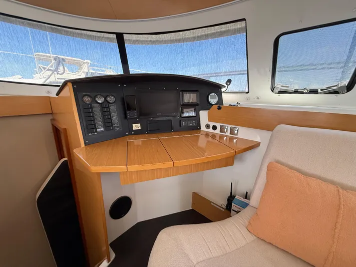 Benevah Yacht Photos Pics Interior helm station of 2013 Fountaine Pajot Lipari 41 catamaran with navigation controls.
