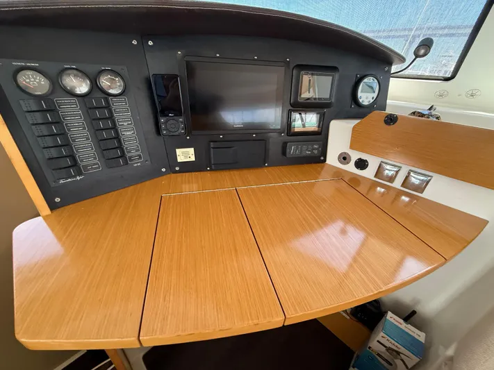 Benevah Yacht Photos Pics Control panel of a 2013 Fountaine Pajot Lipari 41 catamaran with navigation instruments.