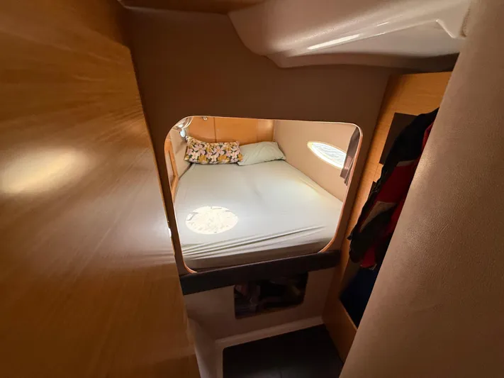 Benevah Yacht Photos Pics Cozy cabin interior of 2013 Fountaine Pajot Lipari 41 catamaran with bed and window.