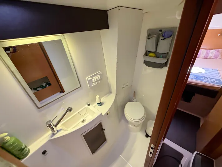 Benevah Yacht Photos Pics Bathroom interior of 2013 Fountaine Pajot Lipari 41 catamaran, featuring sink, toilet, and mirror.