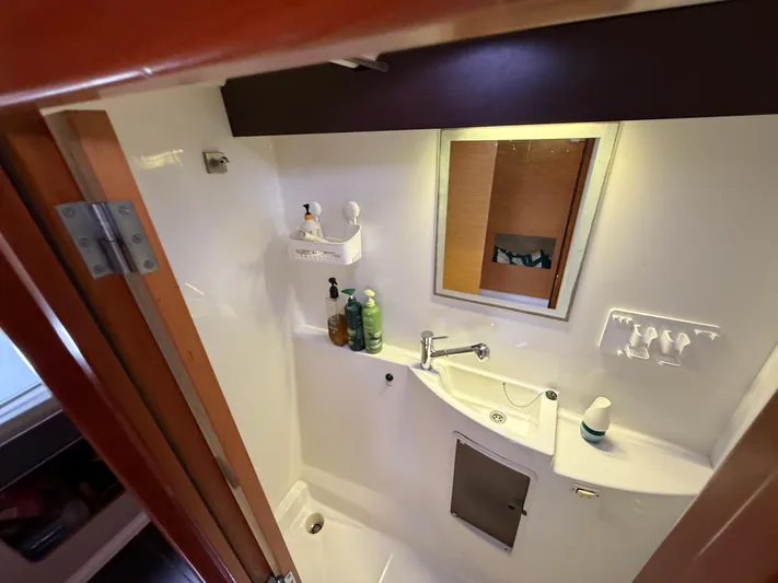Benevah Yacht Photos Pics Bathroom interior of 2013 Fountaine Pajot Lipari 41 catamaran, featuring sink and mirror.
