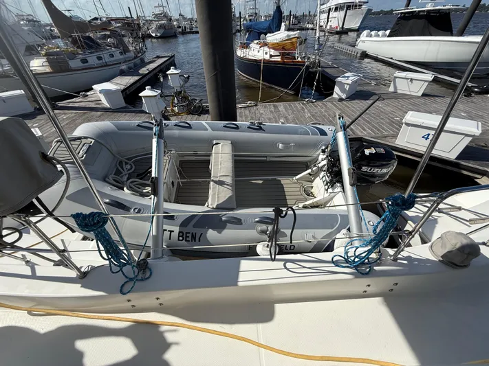 Benevah Yacht Photos Pics 2013 Fountaine Pajot Lipari 41 catamaran with dinghy and Suzuki outboard motor at marina.