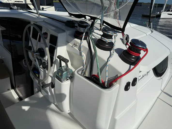 Benevah Yacht Photos Pics Cockpit of 2013 Fountaine Pajot Lipari 41 catamaran with steering wheel and winches.