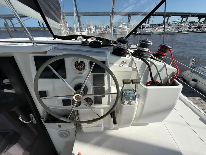 Benevah Yacht Photos Pics Helm of 2013 Fountaine Pajot Lipari 41 catamaran with steering wheel and winches.