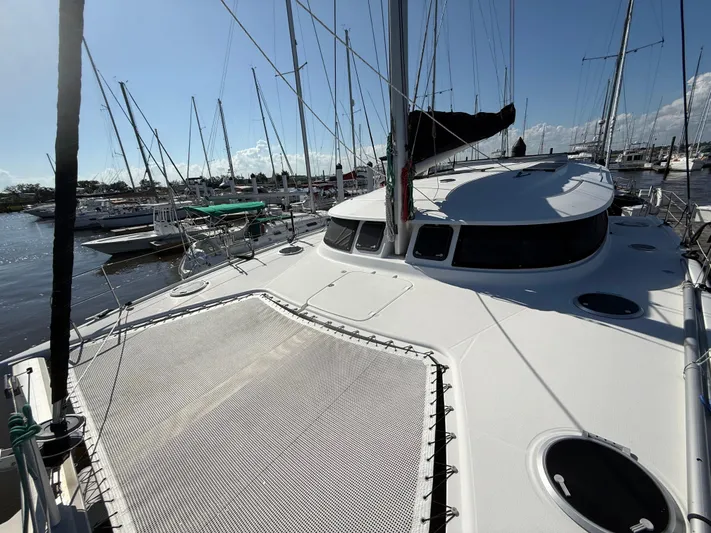 Benevah Yacht Photos Pics 2013 Fountaine Pajot Lipari 41 catamaran docked in a marina under clear blue skies.