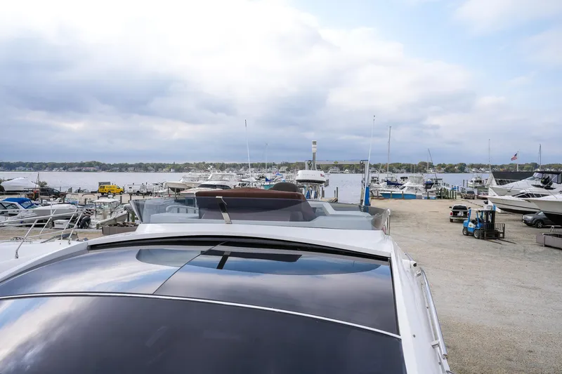  Yacht Photos Pics Galeon 43 SKY 2017 yacht docked at a marina with cloudy sky.