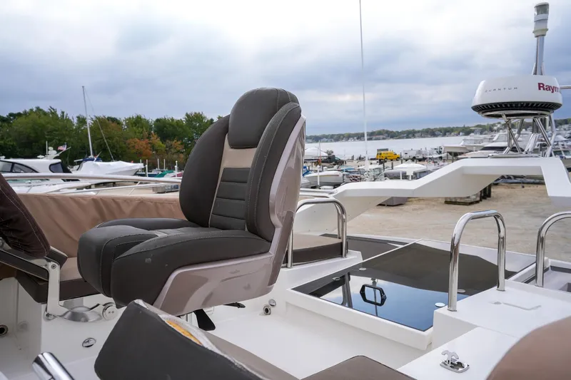  Yacht Photos Pics Galeon 43 SKY 2017 yacht with luxurious seating and marina view.