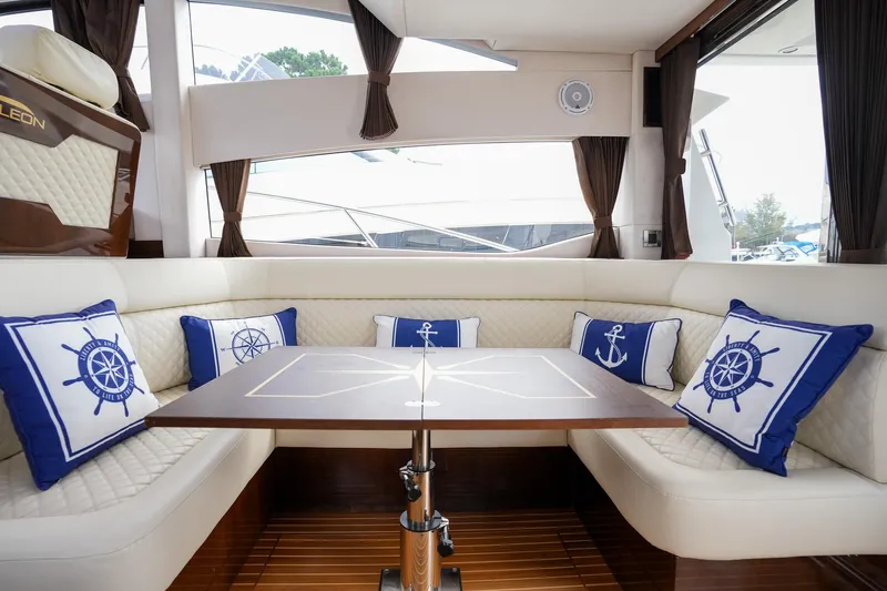  Yacht Photos Pics Luxurious interior of 2017 Galeon 43 SKY yacht with nautical-themed cushions.
