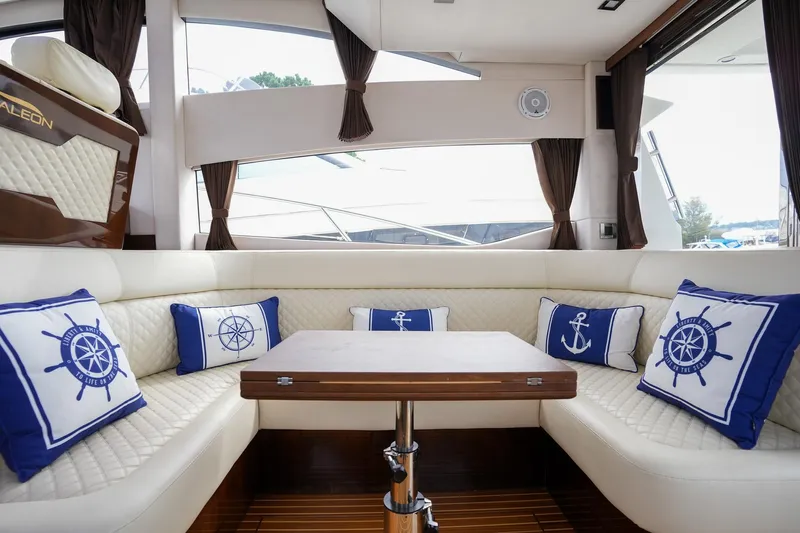  Yacht Photos Pics Luxurious interior of 2017 Galeon 43 SKY yacht with nautical-themed cushions.