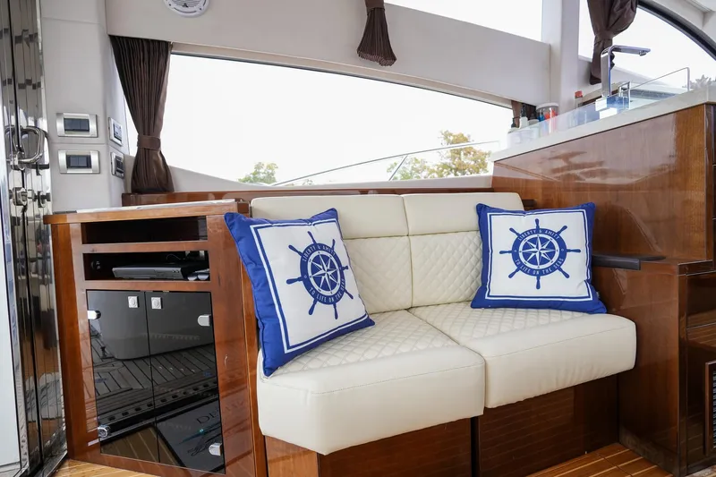  Yacht Photos Pics Luxurious interior of 2017 Galeon 43 SKY yacht with nautical-themed cushions.