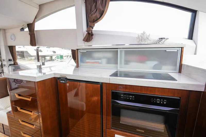  Yacht Photos Pics Luxurious kitchen interior of 2017 Galeon 43 SKY yacht with modern appliances.