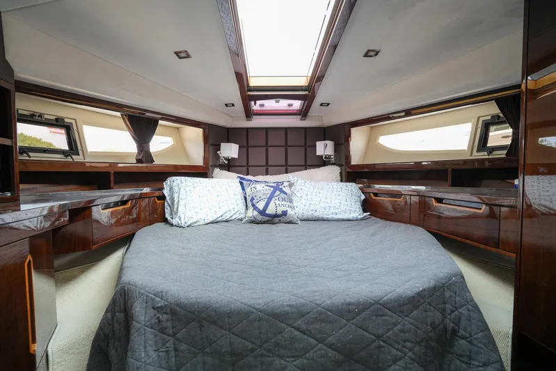  Yacht Photos Pics Luxurious cabin interior of 2017 Galeon 43 SKY yacht with skylight and elegant bedding.