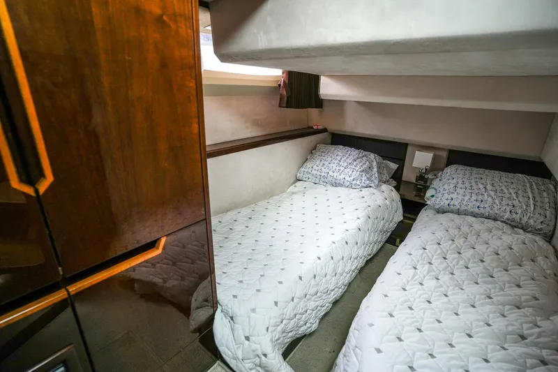  Yacht Photos Pics Twin beds in 2017 Galeon 43 SKY yacht cabin, featuring elegant wood finishes.