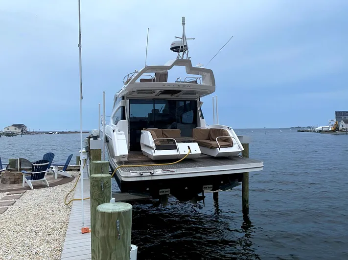  Yacht Photos Pics 2017 Galeon 43 SKY yacht docked by the water on a cloudy day.