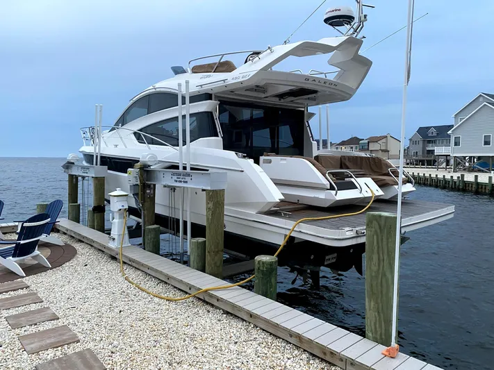 Yacht Photos Pics 2017 Galeon 43 SKY yacht docked at a marina, featuring sleek design and modern amenities.