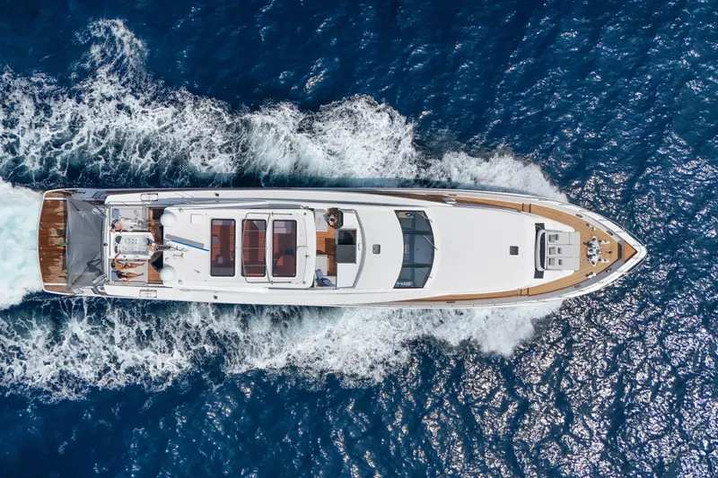Millesime Yacht Photos Pics Aerial view of 2020 Guy Couach 3700 Fly yacht cruising on blue ocean waters.