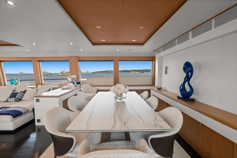 Millesime Yacht Photos Pics Luxurious interior of 2020 Guy Couach 3700 Fly yacht with elegant dining area and sea view.