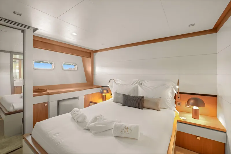 Millesime Yacht Photos Pics Luxurious bedroom interior of 2020 Guy Couach 3700 Fly yacht with modern design and cozy ambiance.