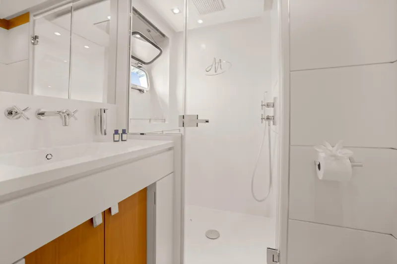 Millesime Yacht Photos Pics Luxurious bathroom on 2020 Guy Couach 3700 Fly yacht, featuring modern fixtures and elegant design.