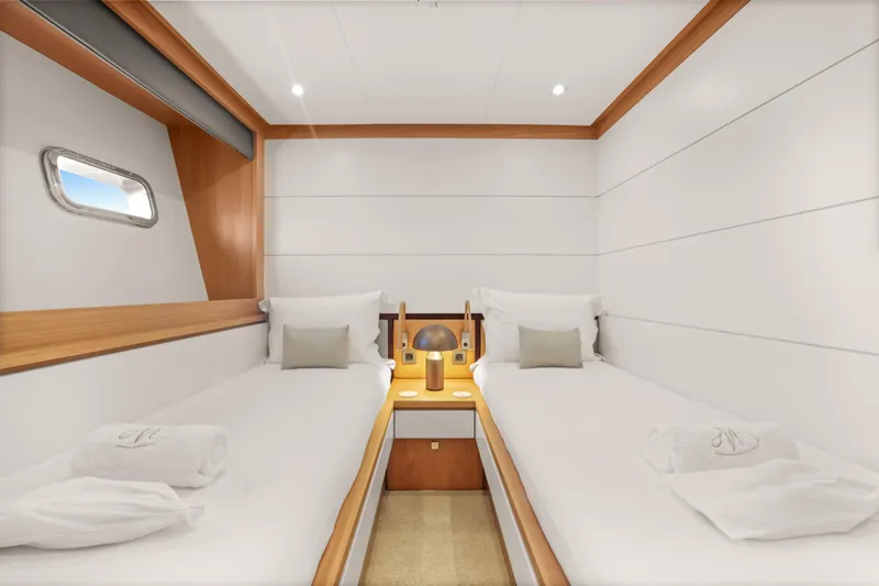 Millesime Yacht Photos Pics Luxurious twin cabin on 2020 Guy Couach 3700 Fly yacht, featuring modern design and cozy ambiance.